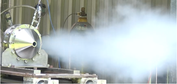 Rocket engine test with a white exhaust plume